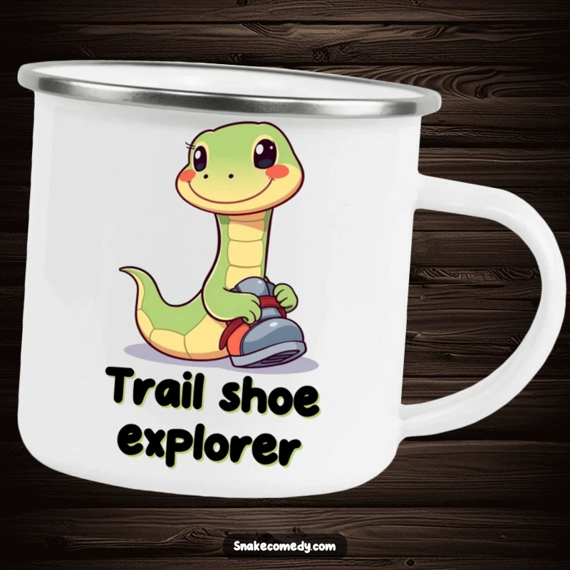 Funny camping mug showing a happy snake with a wide smile playfully trying on a shoe, ideal for cheerful outdoor drinks.
