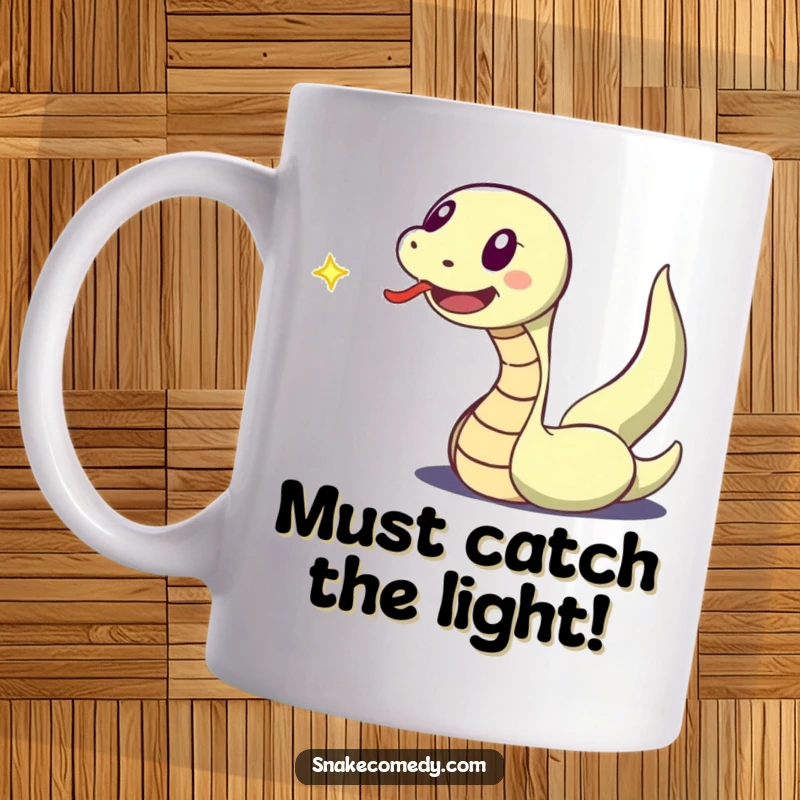 Funny mug featuring an excitedly flicking-tongued snake character in hot pursuit of a dancing speck of light.