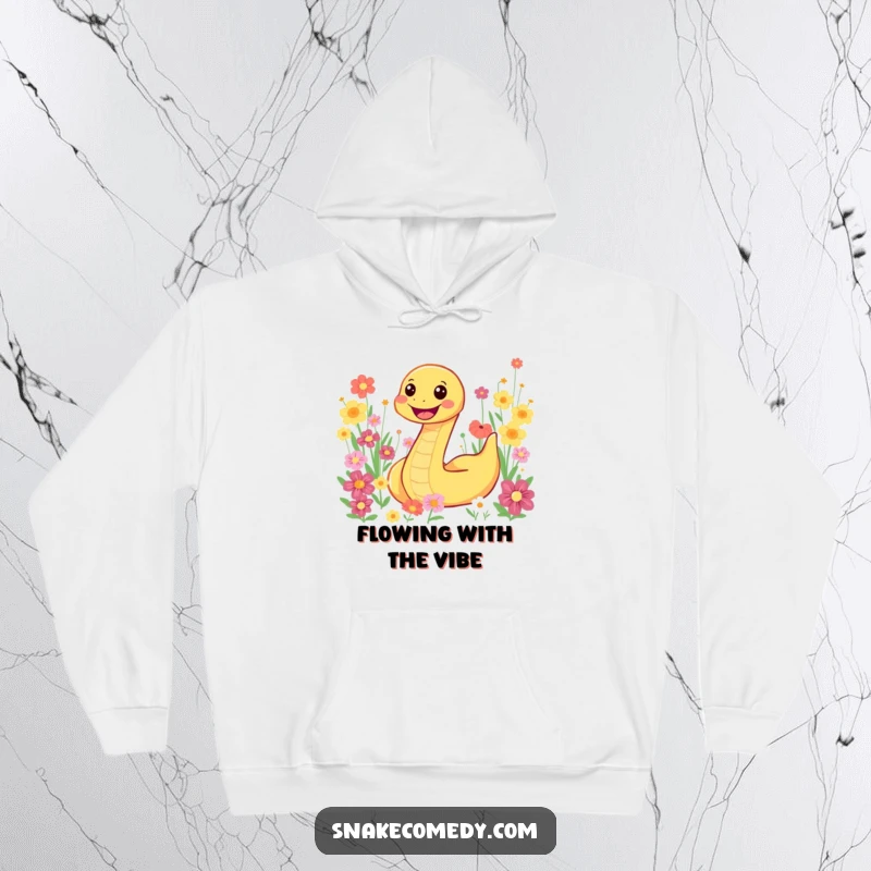 Funny snake character joyfully slithering through a colorful flower field, featured on a cozy hoodie for ultimate comfort.