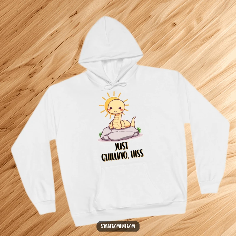 Funny snake hoodie with a contented snake sunning on a rock, perfect for cozy, humorous wear.