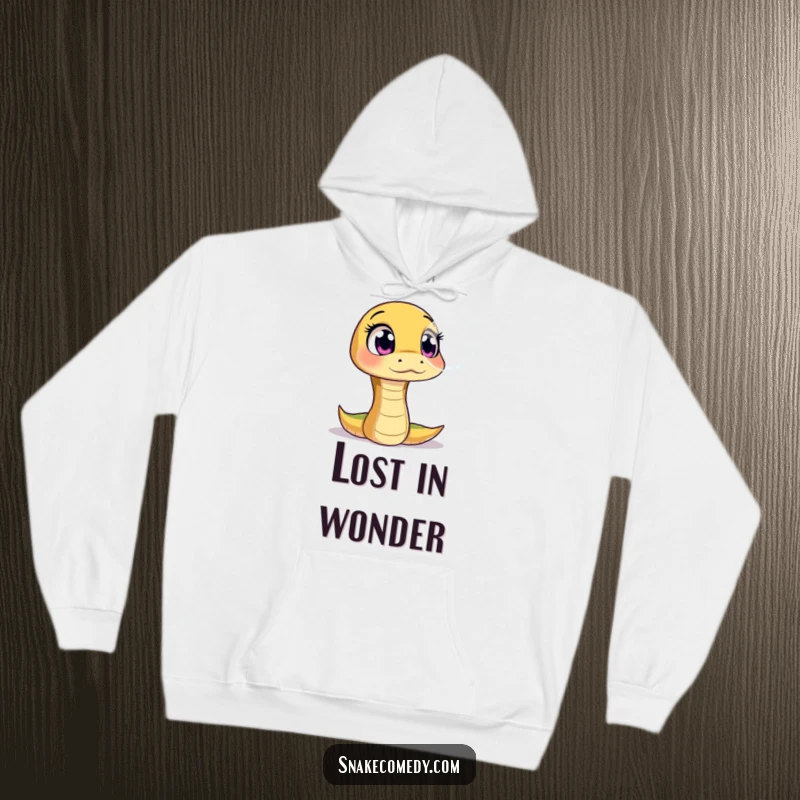 Funny hoodie depicting a snake character with wide, amazed eyes gazing at a floating, shimmering bubble, radiating innocent wonder.