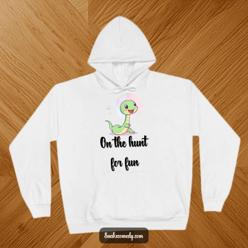 Funny hoodie depicting a happy snake playfully chasing a gorgeous, iridescent soap bubble, conveying a sense of carefree fun.