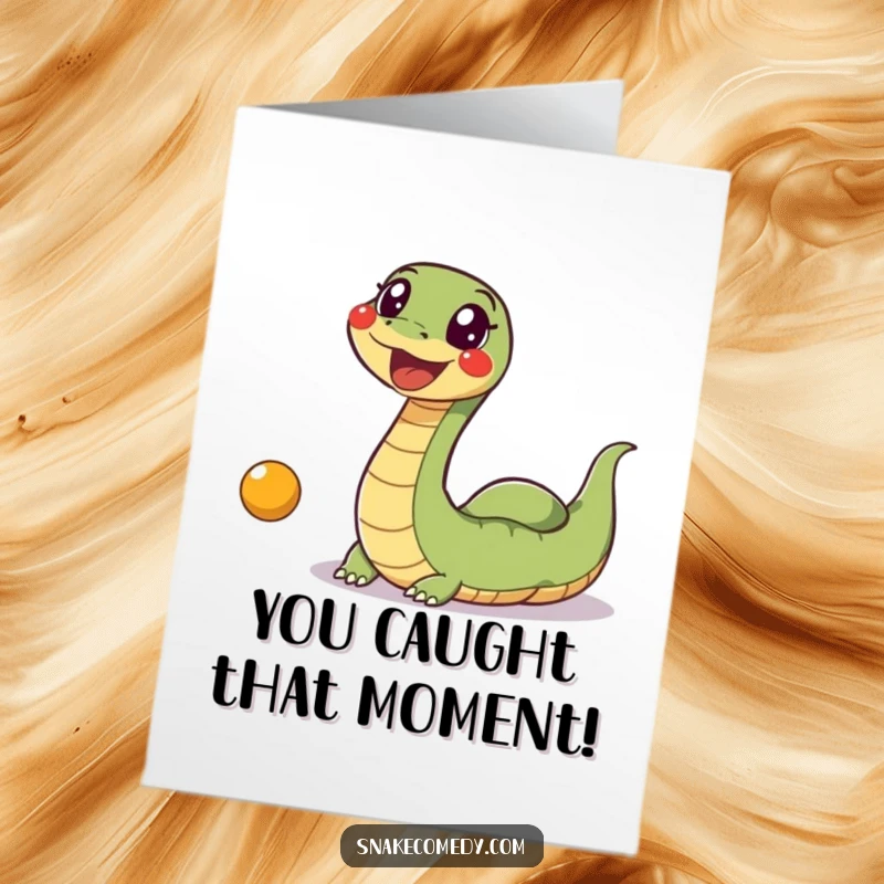 Funny Free Printable Congrats Card: A wildly excited snake enthusiastically pursues a bouncing ball, celebrating success with pure joy.