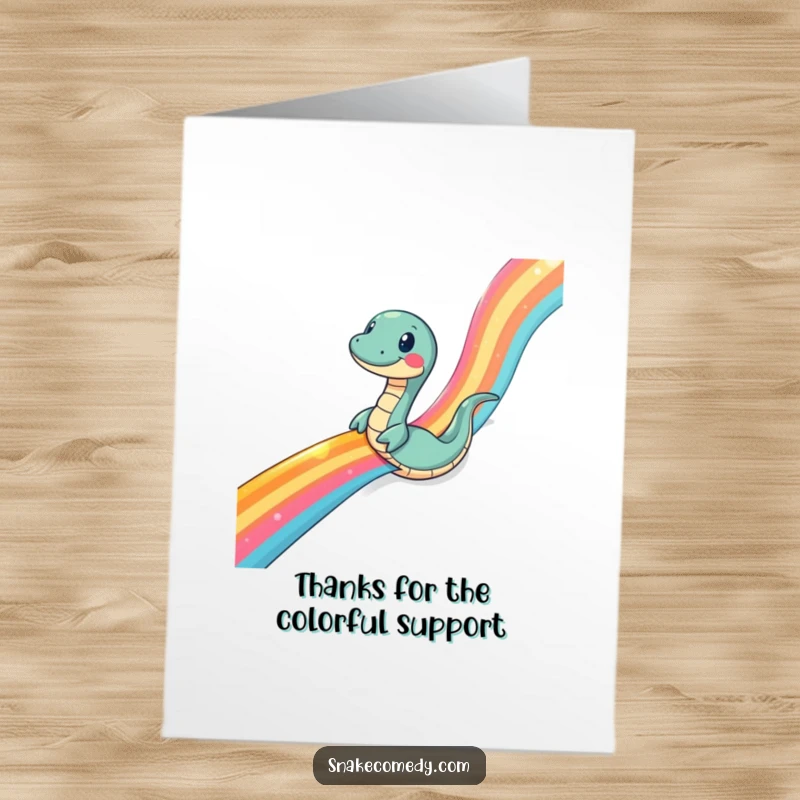 Funny Free Printable Thank You Card: A snake slides hilariously down a shimmering rainbow ribbon, conveying thanks.