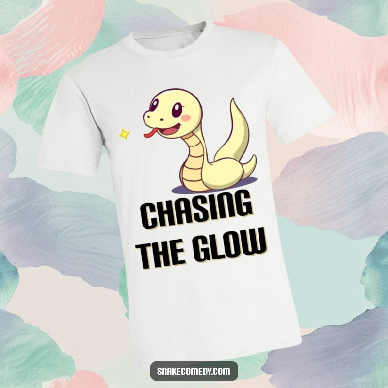 Funny t-shirt depicting a snake character with a flicking tongue, joyfully chasing a dancing speck of light.