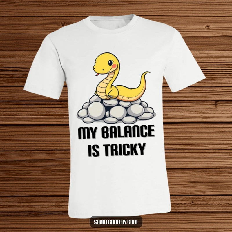 Funny snake t-shirt featuring a cartoon snake comically slipping on a pile of smooth round stones, depicting a hilarious mishap.