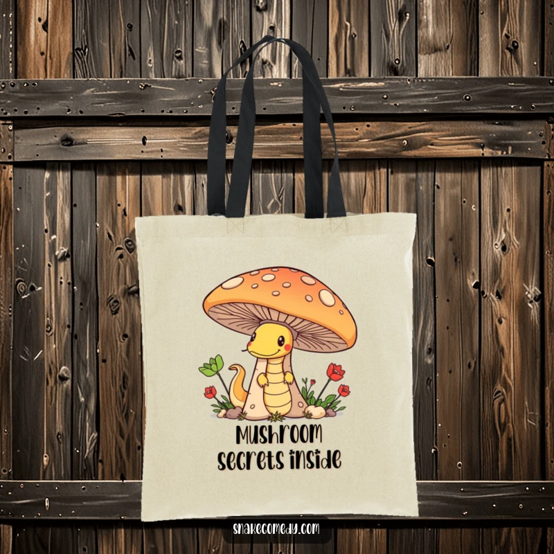 Funny tote bag showcasing a sneaky snake peeking from behind a large mushroom, embodying a spirit of playful mischief.