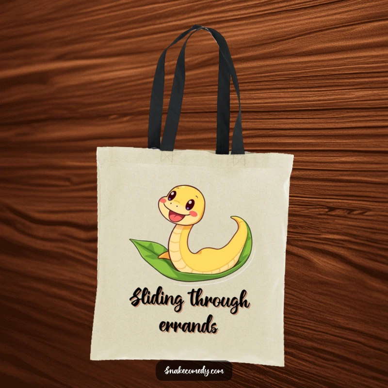 Funny snake tote bag depicting an excited snake wiggling down a leaf, a humorous accessory for travelers.